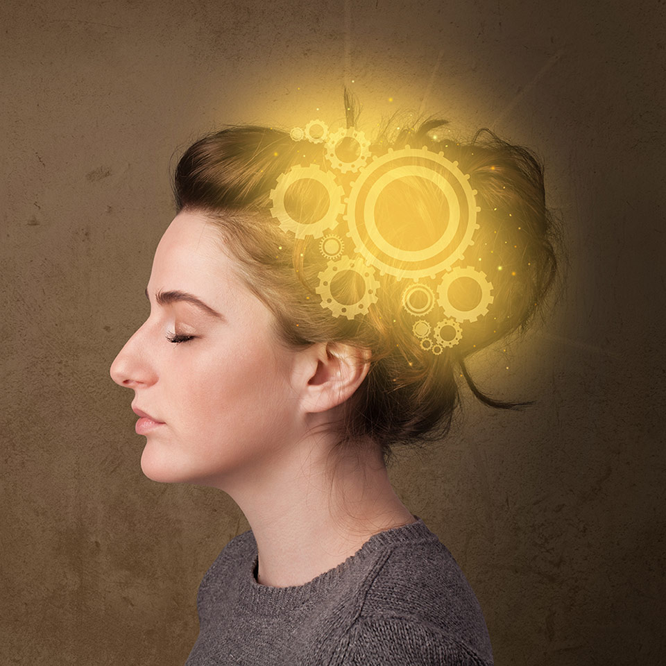 Woman with glowing cogs to illustrate her mind