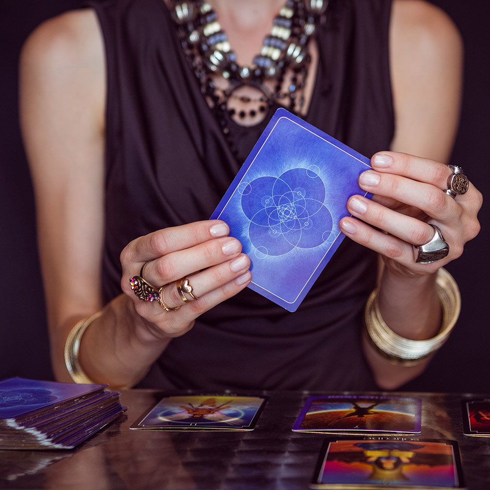 Fortune teller forecasting the future with cards