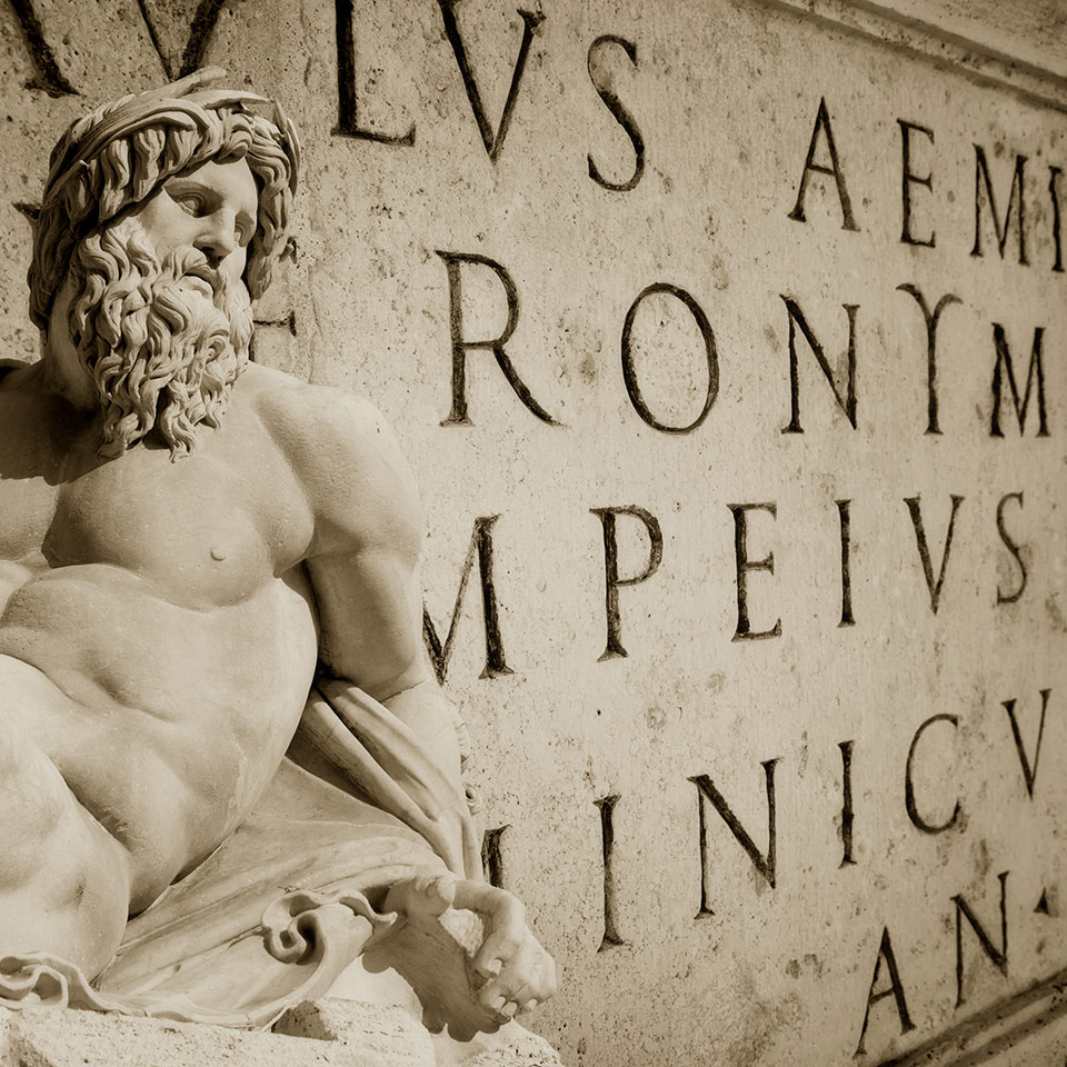 Bernini statue detail of Gange with Latin words engraved on a wall in the Roman Capitol